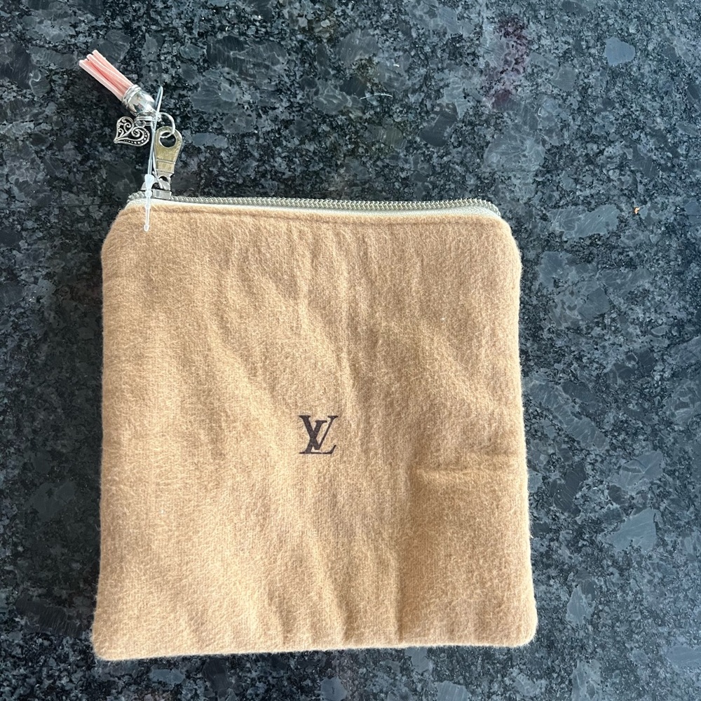 Custom made from Authenic Louis Vuitton dust bag.  Small make up bag